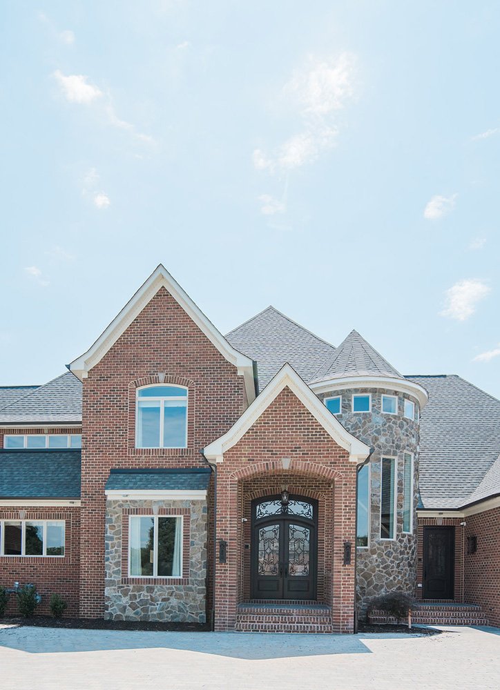 Elegant traditional exterior of a Battaglia West custom home, reflecting meticulous craftsmanship, luxury finishes, and time-honored architectural influences.