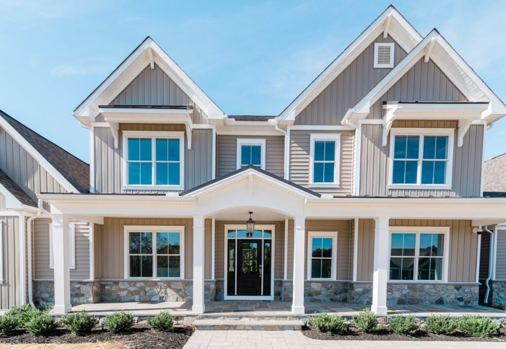 Battaglia West custom home exterior in Western Maryland showcasing a sophisticated blend of grey and black finishes, reflecting modern design, exceptional craftsmanship, and premium materials.